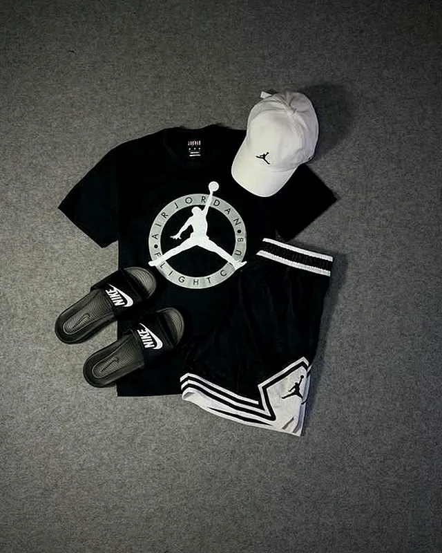 Black Jordan look with slides and a white cap