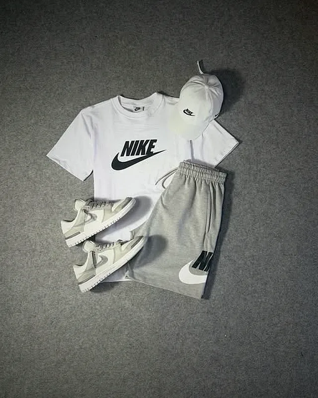 White Nike look with grey shorts and a cap
