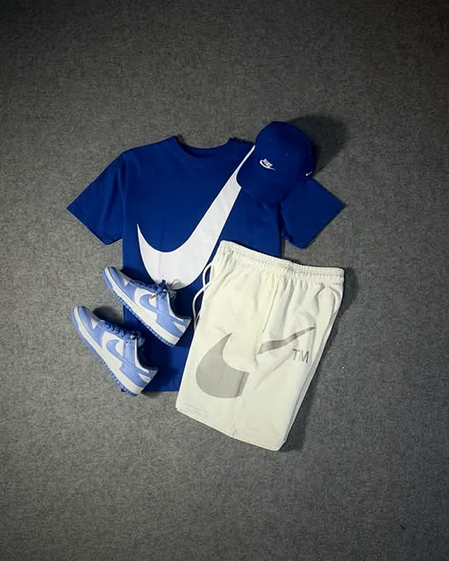 Blue Nike look with light shorts and sneakers